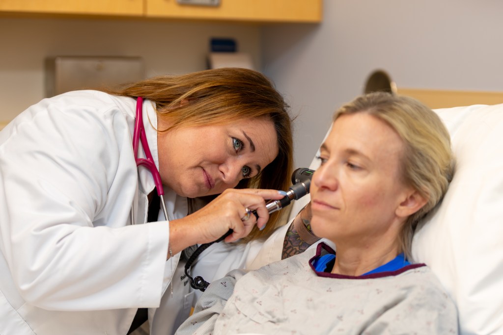 Image of PA using stethoscope on PA